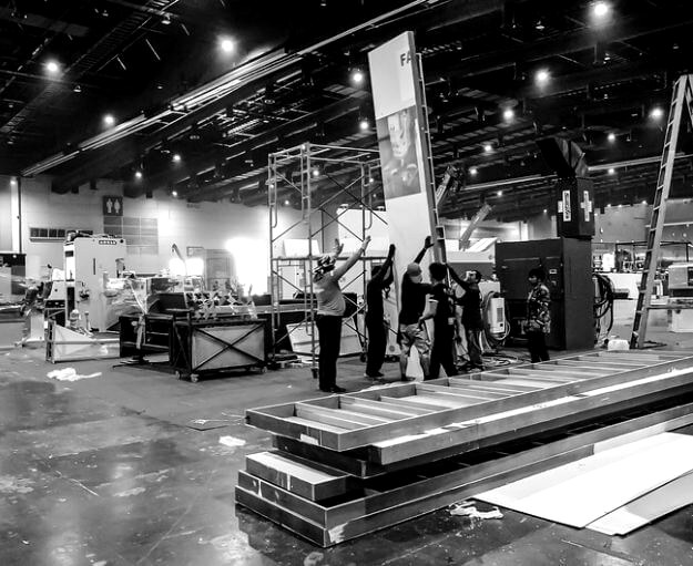 Event production crew building a corporate event set in Singapore