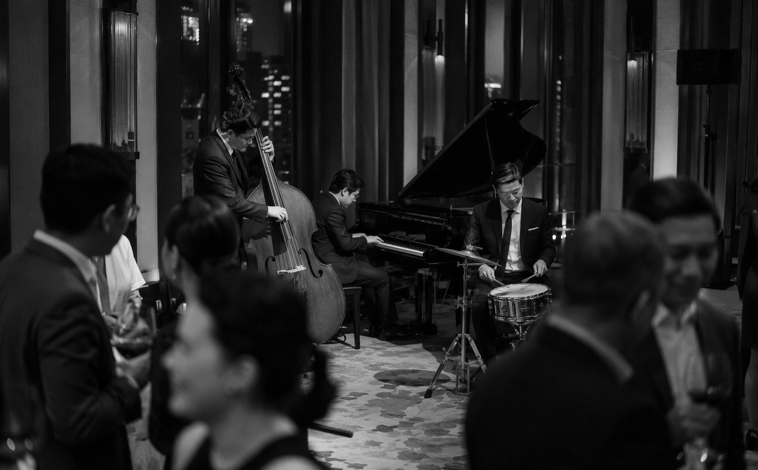 Jazz trio performing live music at an upscale corporate cocktail event in Singapore
