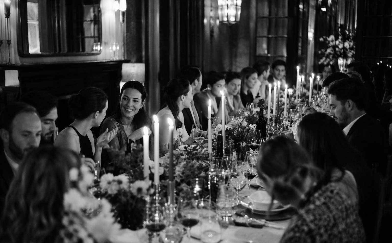 Intimate private party in a Singapore venue with styled table settings and warm ambient lighting